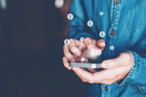 Online banking businessman using smartphone with credit card Fin